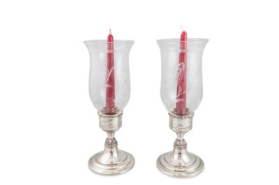 Lot 578 - A PAIR OF MODERN IRISH STERLING SILVER CANDLE...