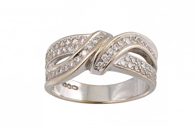 Lot 252 - A DIAMOND CROSS OVER RING, mounted in white...