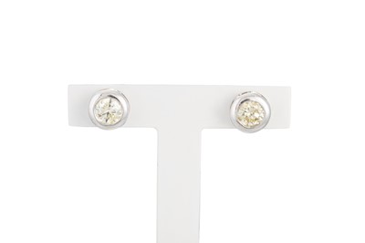 Lot 322 - A PAIR OF DIAMOND SOLITAIRE EARRINGS, collet...