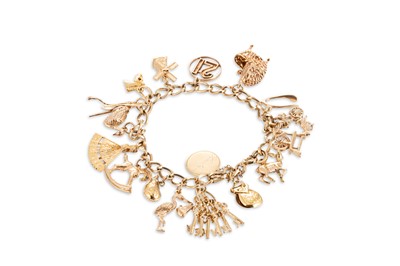 Lot 386 - A CHARM BRACELET, in 9ct yellow gold, with...