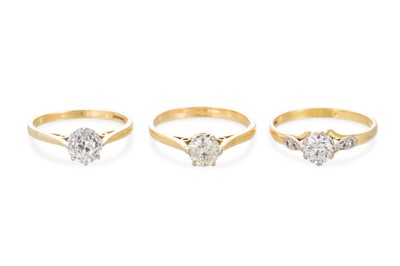 Lot 344 - THREE DIAMOND SOLITAIRE RINGS, one old cut...