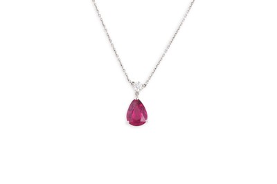 Lot 355 - A TOURMALINE AND DIAMOND PENDANT, the pear...