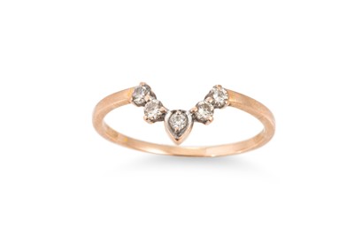 Lot 255 - A DIAMOND SET BAND RING, of wishbone style...