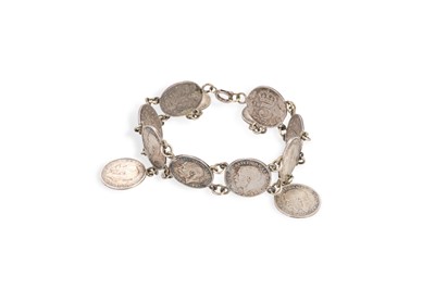 Lot 108 - AN ANTIQUE SILVER BRACELET, set with George V...