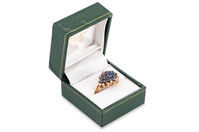 Lot 175 - A SAPPHIRE AND DIAMOND CLUSTER RING, mounted...