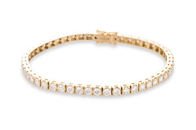 Lot 309 - A DIAMOND LINE BRACELET, the round brilliant...