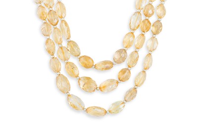 Lot 334 - A VINTAGE THREE ROWED CITRINE NECKLACE, with...