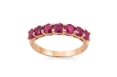 Lot 262 - A RUBY SEVEN STONE RING, mounted in 18ct...