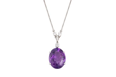 Lot 264 - AN AMETHYST AND DIAMOND PENDANT, the oval...
