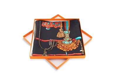 Lot 525 - AN HÉRMES SILK SCARF, boxed with scarf clip