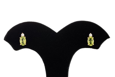 Lot 26 - A PAIR OF DIAMOND AND PERIDOT STUD EARRINGS,...
