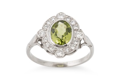 Lot 79 - A PERIDOT AND DIAMOND CLUSTER RING, plaque...