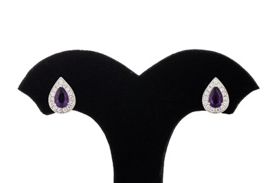 Lot 135 - A PAIR OF DIAMOND AND AMETHYST CLUSTER...