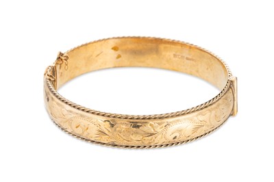 Lot 193 - A 9CT GOLD HINGED BANGLE, 15 g.