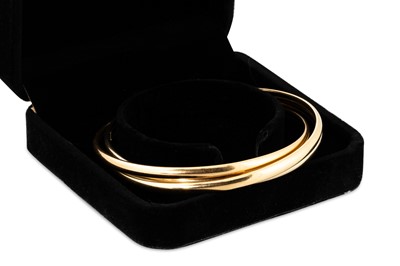 Lot 238 - AN 18CT GOLD BANGLE, comprising three...