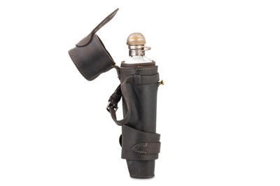 Lot 506 - AN ANTIQUE GLASS FLASK, with leather cover