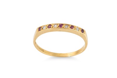 Lot 309 - A DIAMOND AND RUBY ETERNITY RING, mounted in...