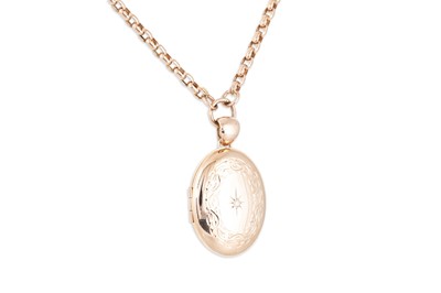 Lot 165 - A 9CT ROSE GOLD LOCKET, set with a diamond on...