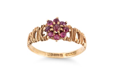 Lot 381 - A RUBY CLUSTER RING, mounted in 9ct gold, size M