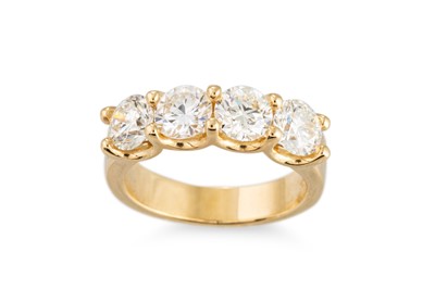 Lot 181 - A FOUR STONE DIAMOND RING, the brilliant cut...