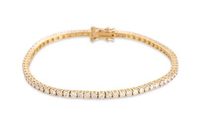 Lot 222 - A DIAMOND LINE BRACELET, the brilliant cut...