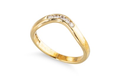 Lot 62 - A DIAMOND CHANNEL SET SHAPED RING, in 18ct gold