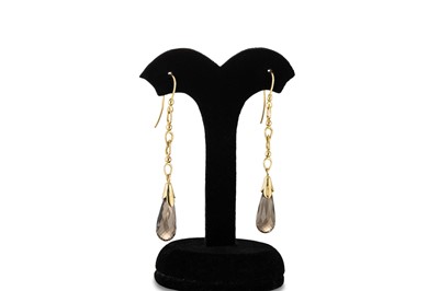 Lot 64 - A PAIR OF SMOKY QUARTZ DROP EARRINGS, mounted...