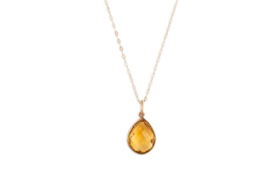 Lot 15 - A CITRINE SET PENDANT, the mixed pear cut...