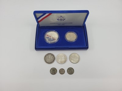 Lot 427 - A 1986 SILVER $1 & SILVER CLAD $½, plus a 1966...