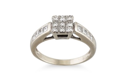 Lot 73 - A DIAMOND CLUSTER RING, set with princess cut...