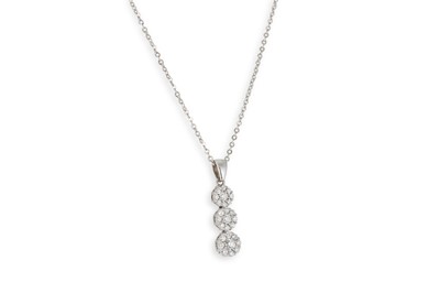 Lot 74 - A DIAMOND CLUSTER PENDANT, of triple cluster...