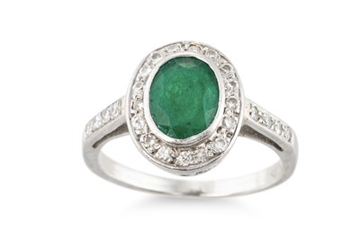 Lot 145 - AN EMERALD AND DIAMOND CLUSTER RING, the oval...