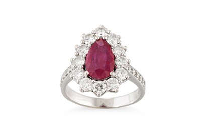 Lot 352 - A DIAMOND AND RUBY CLUSTER RING, the pear...
