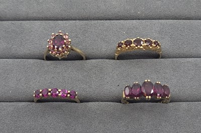 Lot 5 - FOUR GEMSTONE SET CLUSTER RINGS, set with...