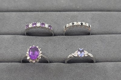 Lot 7 - FOUR GEMSTONE SET RINGS, three mounted in 9 ct...
