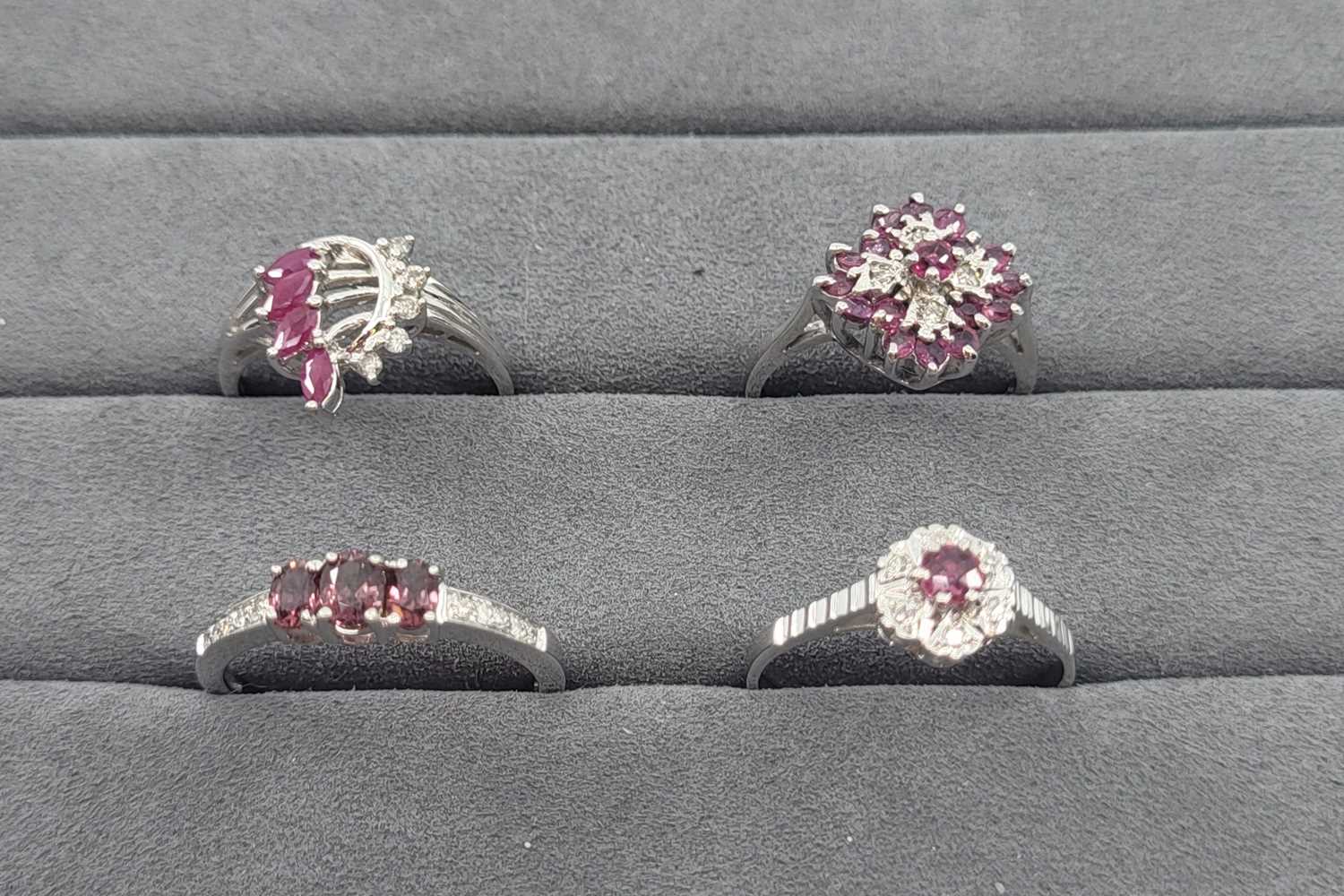 Lot 27 - FOUR GEMSTONE AND DIAMOND SET RINGS, three...
