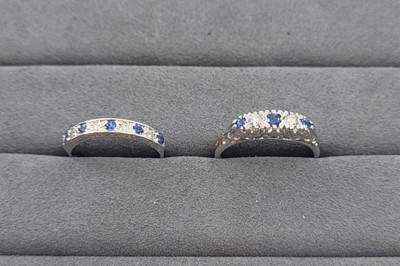 Lot 21 - A SAPPHIRE AND DIAMOND SET BAND RING, together...