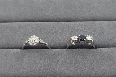Lot 24 - A SAPPHIRE AND DIAMOND THREE STONE RING,...