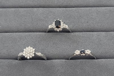 Lot 28 - TWO SAPPHIRE AND DIAMOND SET CLUSTER RINGS,...