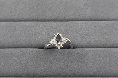 Lot 31 - A SAPPHIRE AND DIAMOND SET CLUSTER RING, the...
