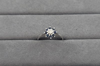Lot 36 - A SAPPHIRE AND DIAMOND CLUSTER RING, the...