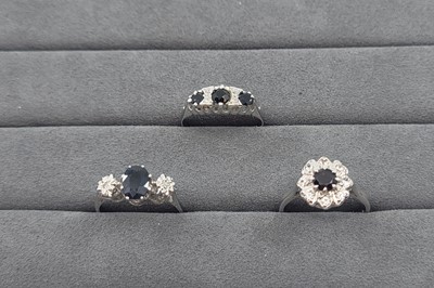 Lot 39 - A SAPPHIRE AND DIAMOND THREE STONE RING,...