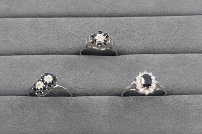 Lot 41 - TWO SAPPHIRE AND DIAMOND SET CLUSTER RINGS,...