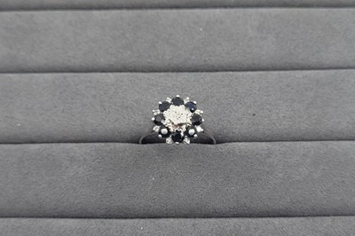 Lot 42 - A SAPPHIRE AND DIAMOND CLUSTER RING, the...