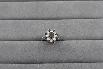 Lot 44 - A SAPPHIRE AND DIAMOND CLUSTER RING, the...