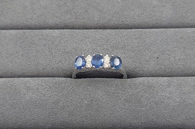 Lot 45 - A SAPPHIRE AND DIAMOND SET BAND RING, the...