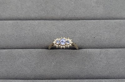 Lot 55 - A SAPPHIRE AND DIAMOND SET CLUSTER RING, the...