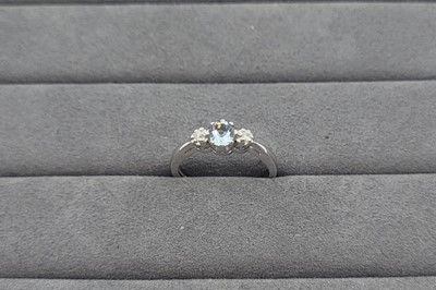 Lot 62 - AN AQUAMARINE AND DIAMOND THREE STONE RING,...