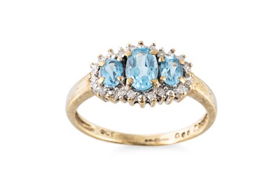 Lot 67 - A TOPAZ AND DIAMOND CLUSTER RING, the trio of...