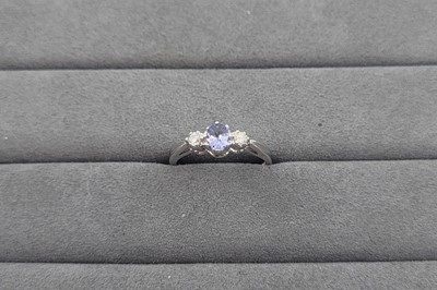 Lot 68 - A TANZANITE AND DIAMOND SET THREE STONE RING,...